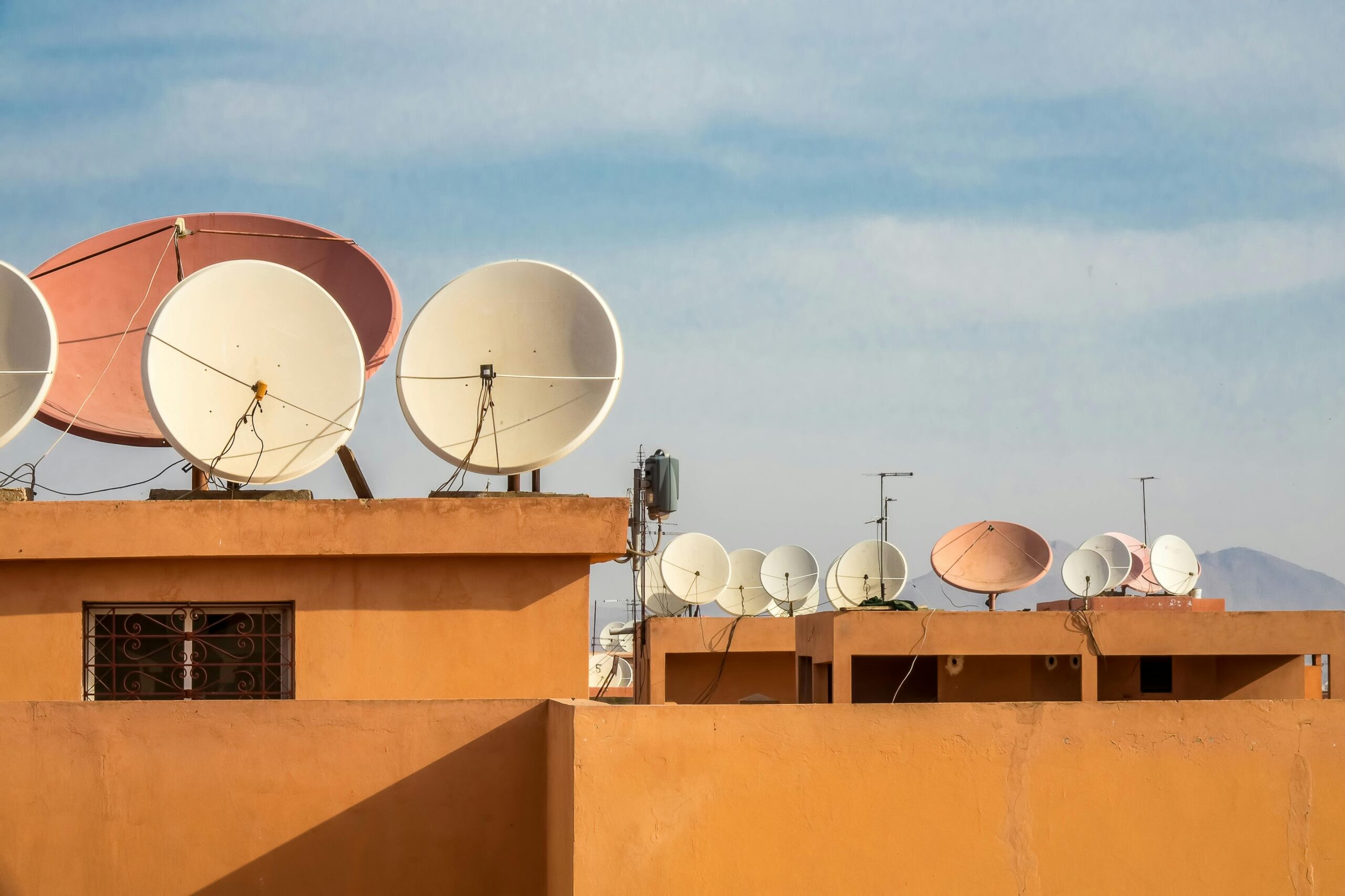 White Satellite Dish on Orange Roof